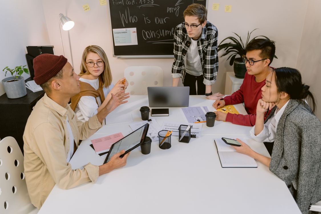 People sharing ideas around a table